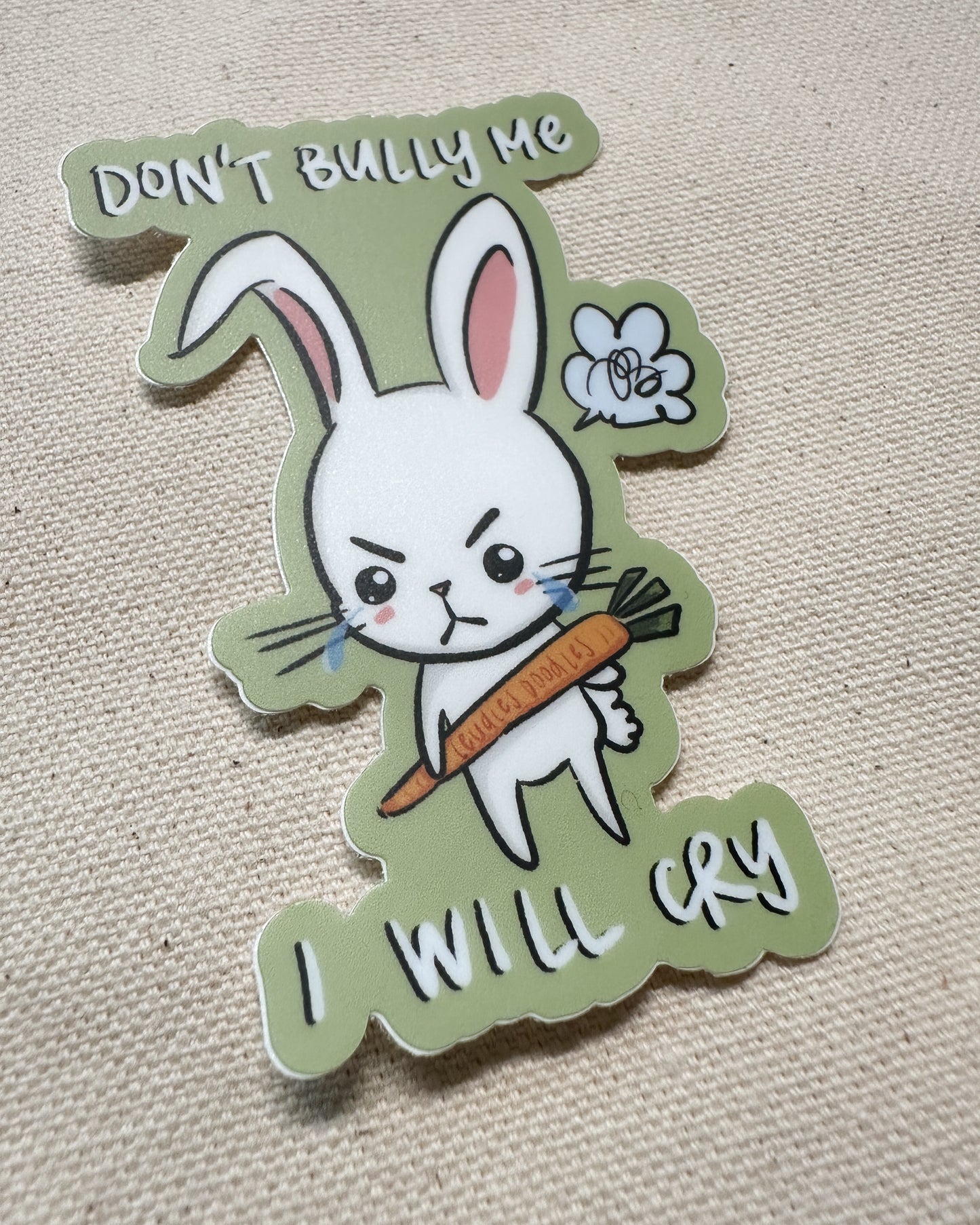Sticker with a cartoon rabbit holding a carrot and text that says "Don't Bully Me, I Will Cry"