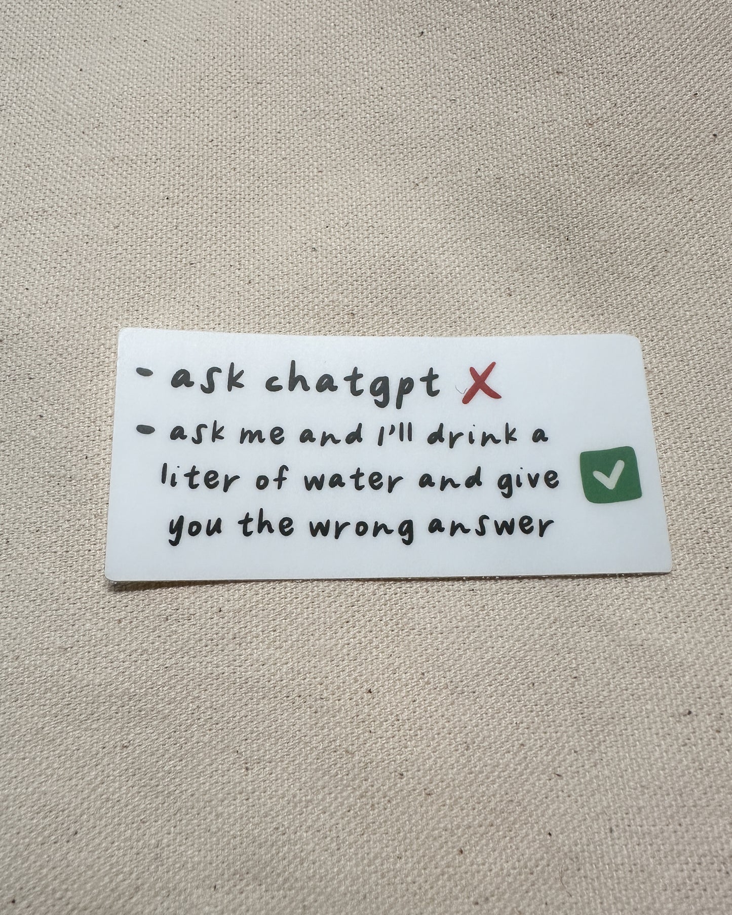 matte sticker with black text on white background, "ask chatgpt" vs "ask me and I'll drink a liter of water and give you the wrong answer"