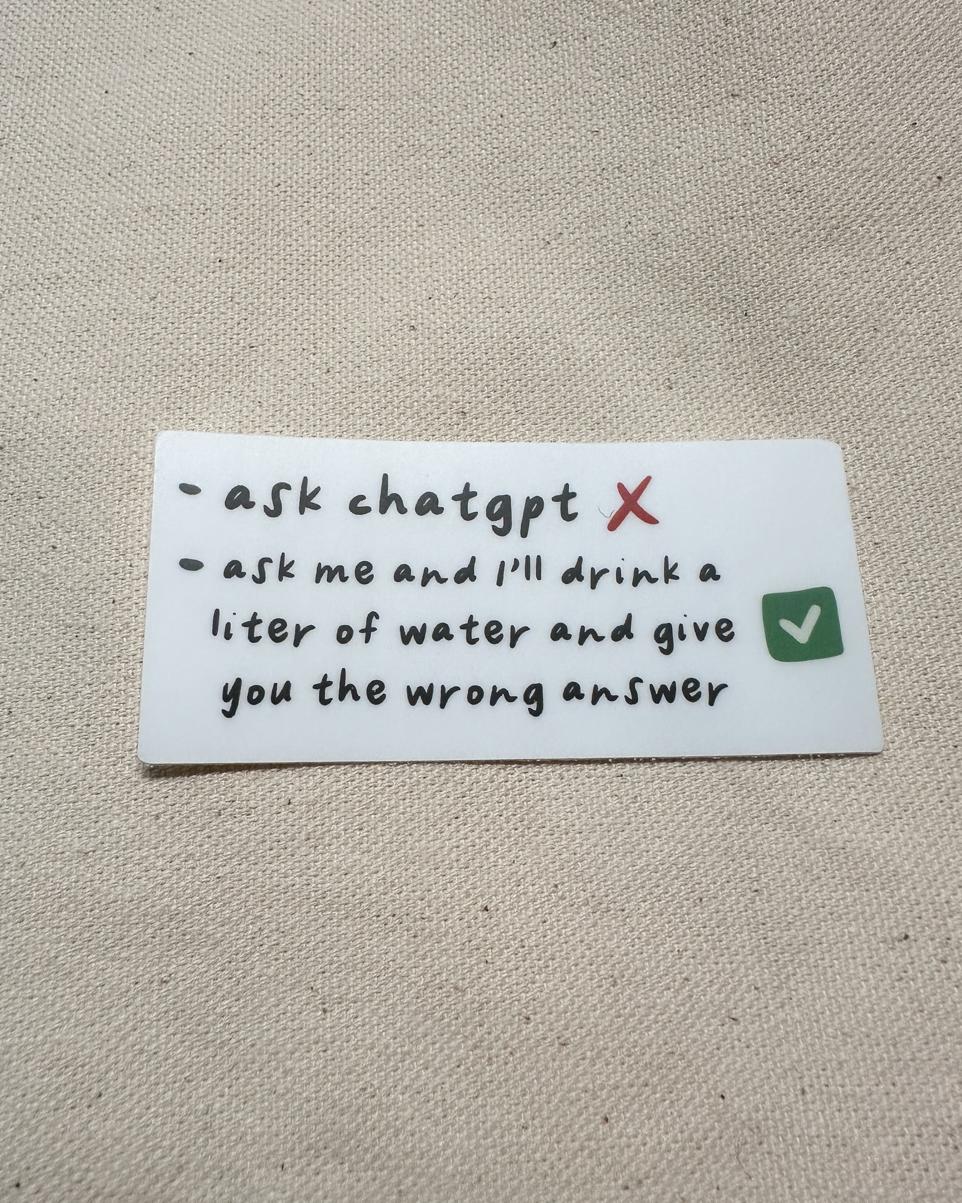 matte sticker with black text on white background, "ask chatgpt" vs "ask me and I'll drink a liter of water and give you the wrong answer"